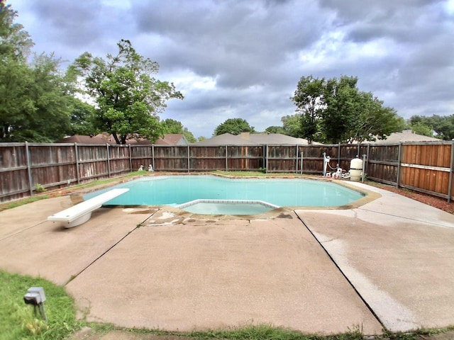 1619 Marquette Dr, Richardson, TX 75081 - view of pool with a patio area, a diving board, and a fenced backyard