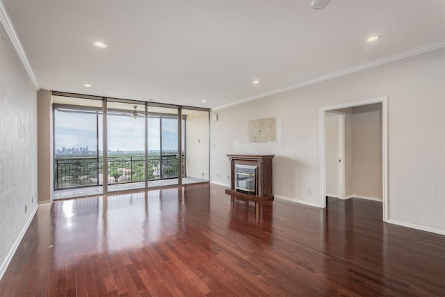6335 W NW Hwy Unit 1314, Dallas, TX 75225 - unfurnished living room with floor to ceiling windows, crown molding, wood finished floors, a glass covered fireplace, and baseboards