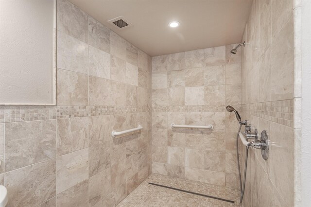 6335 W NW Hwy Unit 1314, Dallas, TX 75225 - full bathroom featuring tiled shower and recessed lighting