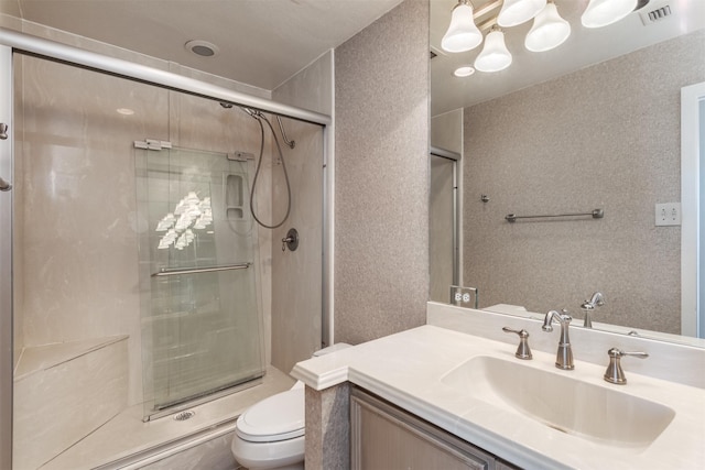 6335 W NW Hwy Unit 1314, Dallas, TX 75225 - bathroom with toilet, vanity, and a stall shower