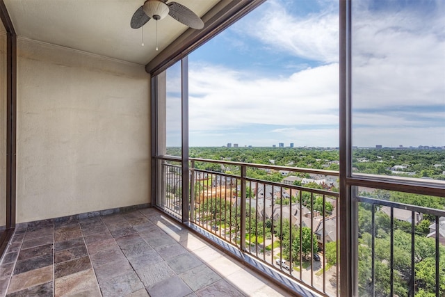 6335 W NW Hwy Unit 1314, Dallas, TX 75225 - balcony featuring a city view and a ceiling fan