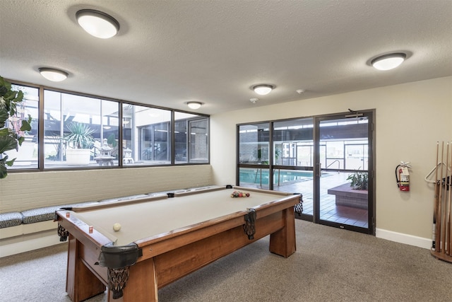 6335 W NW Hwy Unit 1314, Dallas, TX 75225 - game room with billiards, a textured ceiling, carpet flooring, and baseboards