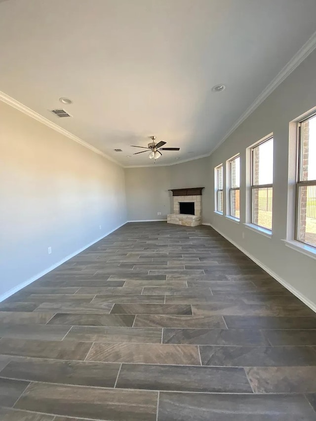 523 Long Pr, Royse City, TX 75189 - unfurnished living room featuring ceiling fan, a fireplace, baseboards, crown molding, and recessed lighting