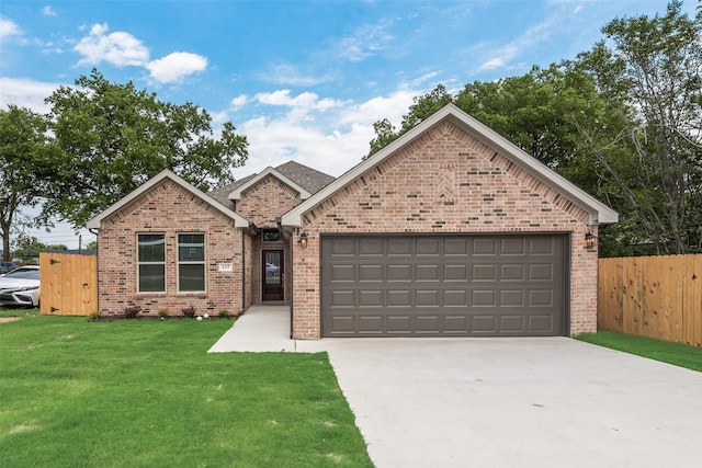 137 Willow Ln, Roanoke, TX 76262 - view of front facade featuring brick siding, driveway, and a garage