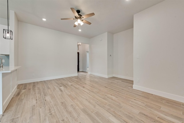 137 Willow Ln, Roanoke, TX 76262 - empty room with a ceiling fan, light wood-style floors, recessed lighting, and baseboards