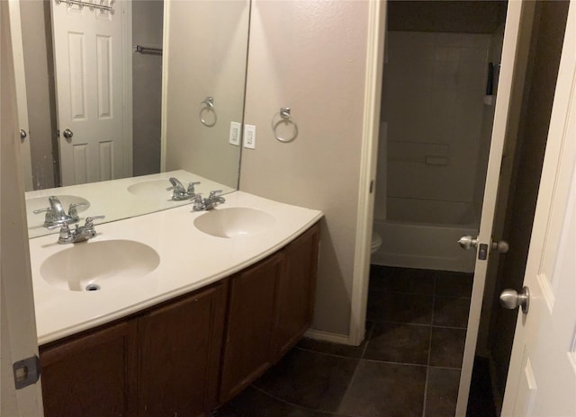 206 Bison Meadow Dr, Waxahachie, TX 75165 - bathroom with tile patterned floors, double vanity, toilet, and  shower combination