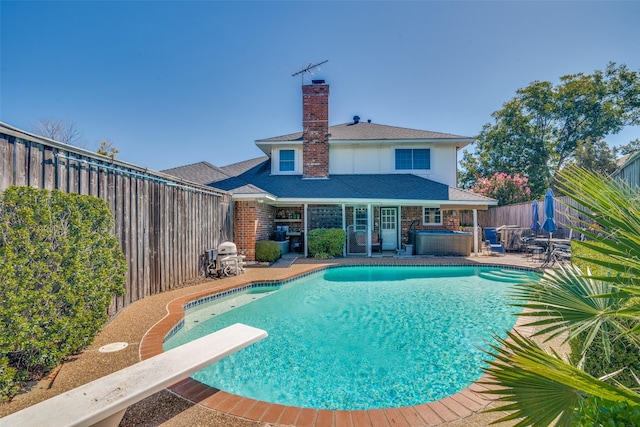 321 Kingsbridge Dr, Garland, TX 75040 - view of pool with a fenced backyard, a hot tub, a patio, a diving board, and area for grilling