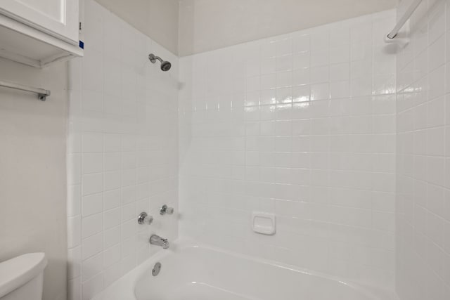 2911 Post Oak Dr, Euless, TX 76039 - bathroom featuring toilet and shower / washtub combination