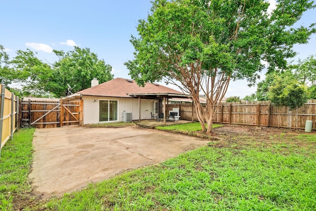 2911 Post Oak Dr, Euless, TX 76039 - rear view of house with a chimney, a fenced backyard, a patio area, and a gate