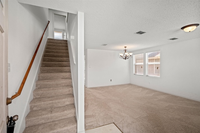 16616 Jasmine Springs Dr, Fort Worth, TX 76247 - stairs with carpet flooring, a chandelier, and a textured ceiling