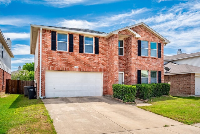 16616 Jasmine Springs Dr, Fort Worth, TX 76247 - traditional home with driveway, an attached garage, brick siding, and central AC unit