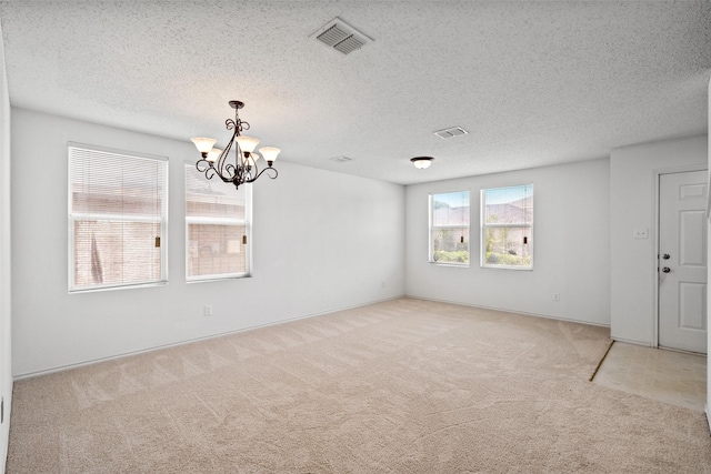 16616 Jasmine Springs Dr, Fort Worth, TX 76247 - empty room with light colored carpet, a chandelier, a textured ceiling, and baseboards