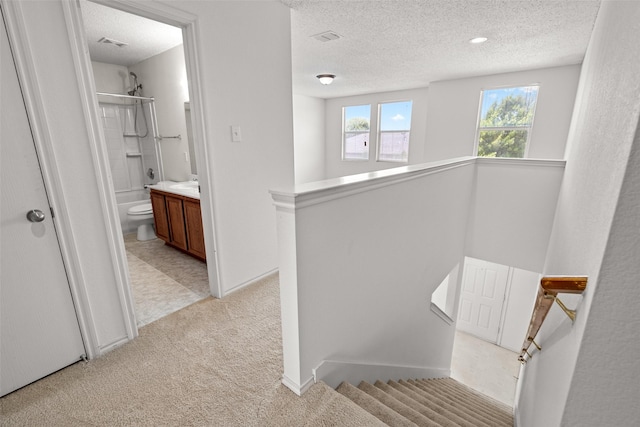 16616 Jasmine Springs Dr, Fort Worth, TX 76247 - stairs featuring a textured ceiling and carpet