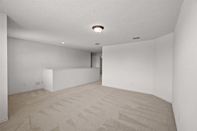 16616 Jasmine Springs Dr, Fort Worth, TX 76247 - empty room featuring carpet, a textured ceiling, and baseboards