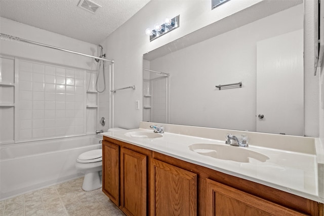 16616 Jasmine Springs Dr, Fort Worth, TX 76247 - full bathroom with  shower combination, toilet, double vanity, and a textured ceiling
