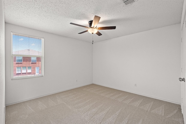 16616 Jasmine Springs Dr, Fort Worth, TX 76247 - spare room with light colored carpet, a ceiling fan, and a textured ceiling