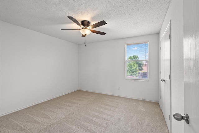 16616 Jasmine Springs Dr, Fort Worth, TX 76247 - carpeted empty room with a ceiling fan, a textured ceiling, and baseboards