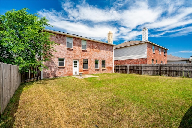 16616 Jasmine Springs Dr, Fort Worth, TX 76247 - rear view of house with brick siding and a chimney