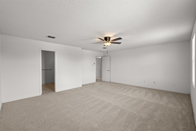16616 Jasmine Springs Dr, Fort Worth, TX 76247 - empty room with light carpet, a ceiling fan, a textured ceiling, and baseboards