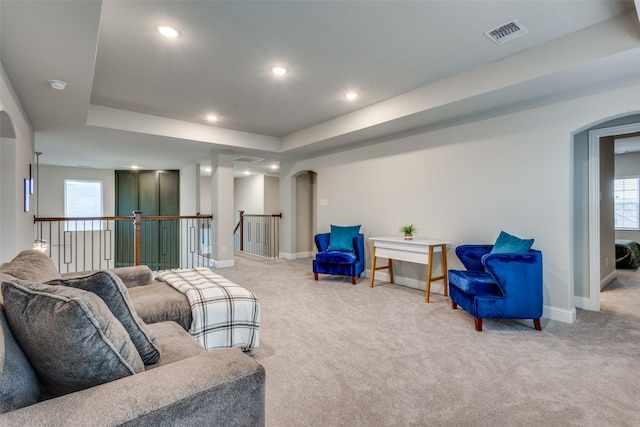 1421 Benavites Dr, Little Elm, TX 75068 - living area featuring arched walkways, carpet flooring, baseboards, and recessed lighting