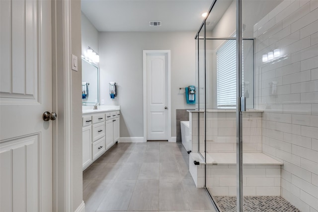 1421 Benavites Dr, Little Elm, TX 75068 - full bath featuring vanity, a stall shower, baseboards, and a tub to relax in