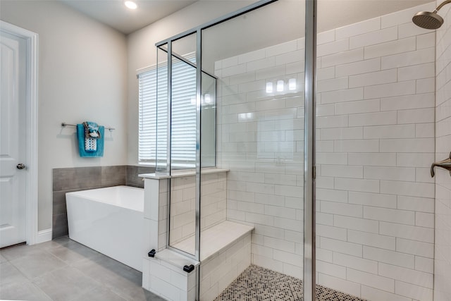 1421 Benavites Dr, Little Elm, TX 75068 - bathroom with a stall shower, a freestanding tub, recessed lighting, and tile patterned flooring