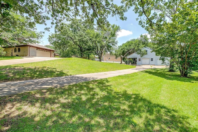 502 Roaring Springs Dr, Joshua, TX 76058 - view of grassy yard with a garage and driveway