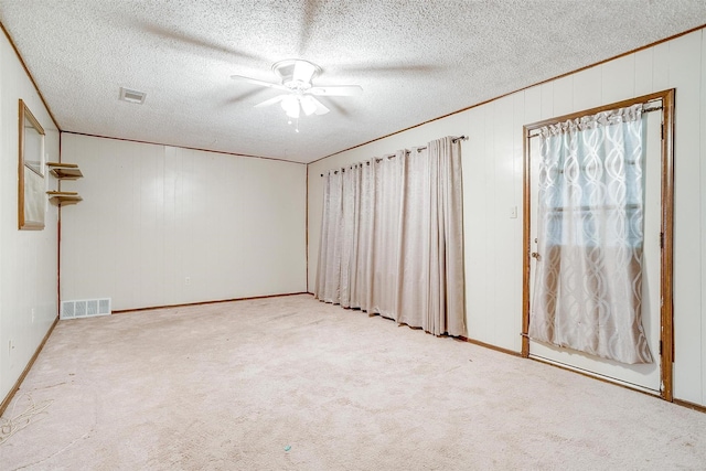 502 Roaring Springs Dr, Joshua, TX 76058 - spare room with a ceiling fan, carpet flooring, baseboards, and a textured ceiling