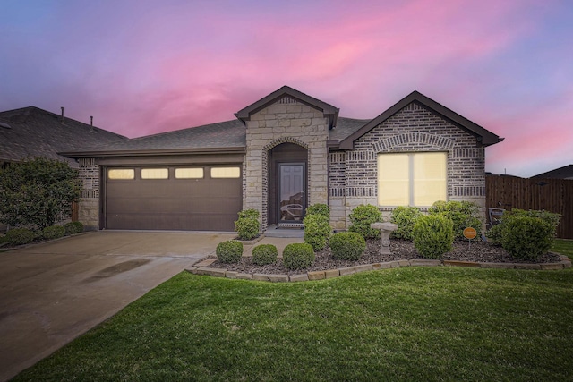 3446 Kirby Ln, Forney, TX 75126 - view of front of house with stone siding, an attached garage, driveway, and roof with shingles