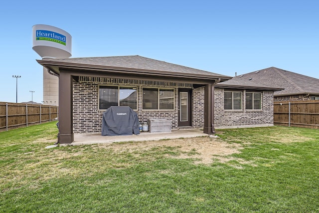 3446 Kirby Ln, Forney, TX 75126 - back of house with brick siding, a patio, and a shingled roof