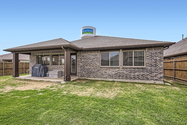 3446 Kirby Ln, Forney, TX 75126 - rear view of property featuring brick siding, a patio, and roof with shingles