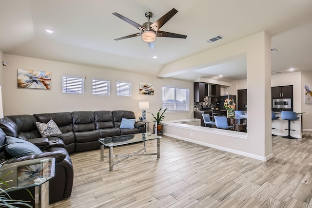 3446 Kirby Ln, Forney, TX 75126 - living area with light wood finished floors, ceiling fan, recessed lighting, and baseboards