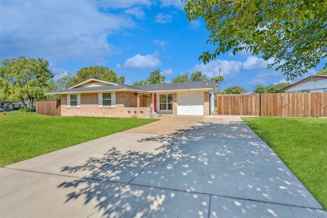 2425 Misty Ln, Carrollton, TX 75006 - ranch-style home with a garage, driveway, and brick siding