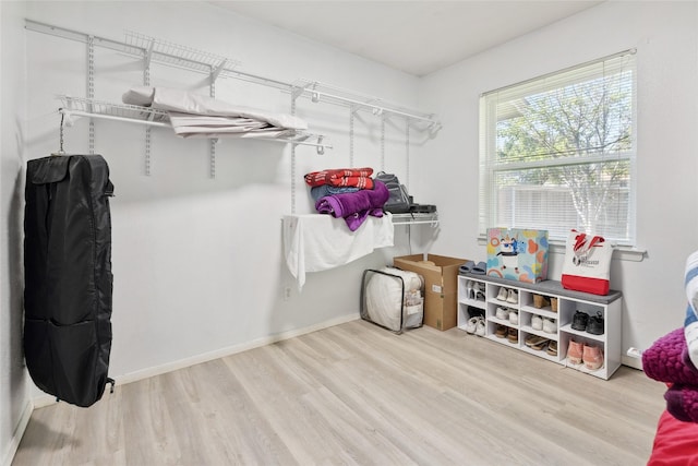 2425 Misty Ln, Carrollton, TX 75006 - walk in closet with wood finished floors