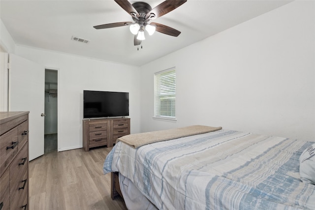 2425 Misty Ln, Carrollton, TX 75006 - bedroom featuring light wood-style flooring and ceiling fan