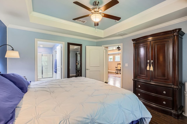 8745 Twin Pines Ln, Frisco, TX 75036 - bedroom with a raised ceiling, wood finished floors, ornamental molding, a ceiling fan, and ensuite bath