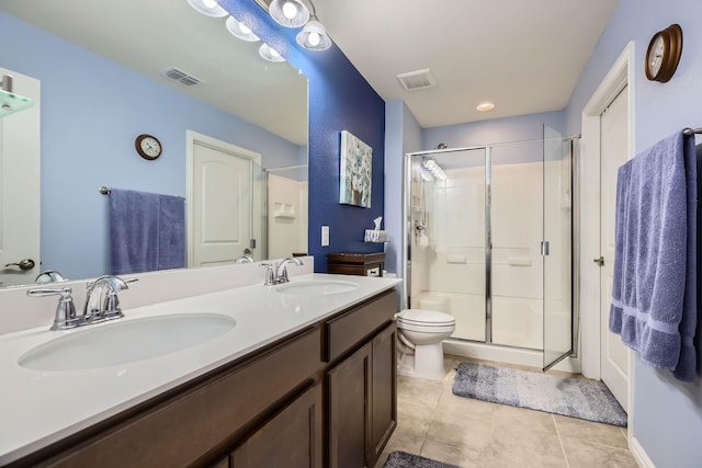 8745 Twin Pines Ln, Frisco, TX 75036 - full bath with a stall shower, double vanity, tile patterned flooring, and toilet