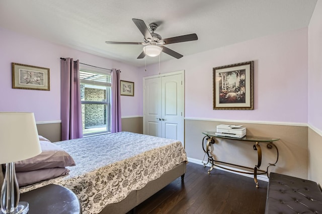 8745 Twin Pines Ln, Frisco, TX 75036 - bedroom featuring dark wood-style flooring, a closet, baseboards, and ceiling fan