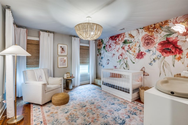 4017 Piedmont Rd, Fort Worth, TX 76116 - bedroom with a chandelier, wood finished floors, and a nursery area