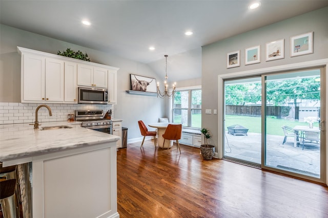 4017 Piedmont Rd, Fort Worth, TX 76116 - kitchen featuring stainless steel appliances, a sink, white cabinetry, backsplash, and light stone counters