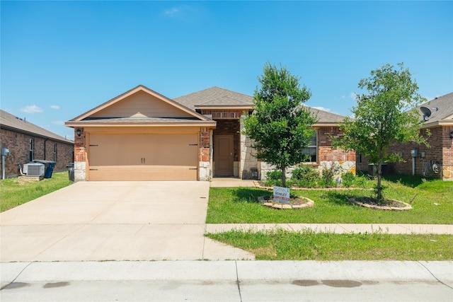 708 Rustic Meadows Trl, Princeton, TX 75407 - view of front of property featuring a garage, concrete driveway, a front yard, central AC, and stone siding