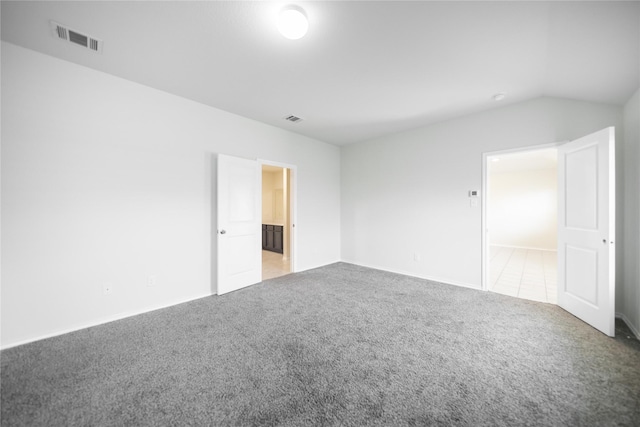 708 Rustic Meadows Trl, Princeton, TX 75407 - spare room featuring light carpet, lofted ceiling, and baseboards