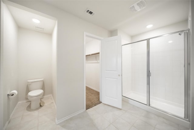 708 Rustic Meadows Trl, Princeton, TX 75407 - full bathroom with toilet, a shower stall, a walk in closet, tile patterned flooring, and baseboards