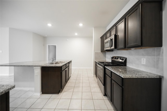 708 Rustic Meadows Trl, Princeton, TX 75407 - kitchen featuring appliances with stainless steel finishes, a sink, light tile patterned flooring, a center island with sink, and recessed lighting