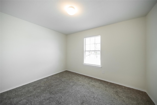 708 Rustic Meadows Trl, Princeton, TX 75407 - unfurnished room with dark colored carpet and baseboards