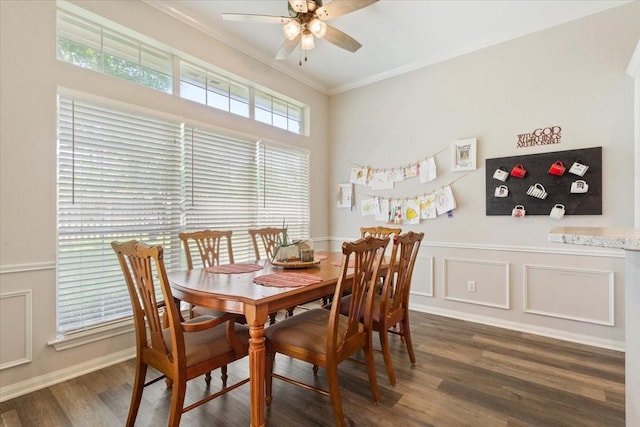 713 Tahoe Trl, Hewitt, TX 76643 - dining area with crown molding, a ceiling fan, wood finished floors, and wainscoting