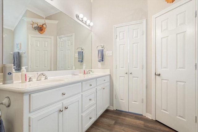 713 Tahoe Trl, Hewitt, TX 76643 - full bathroom featuring ornamental molding, double vanity, wood finished floors, a closet, and baseboards