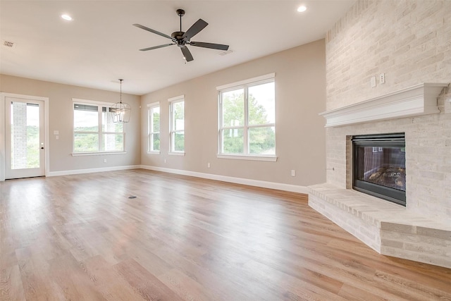 8732 Fullerton Dr, Cleburne, TX 76033 - unfurnished living room featuring baseboards, ceiling fan, a brick fireplace, light wood-style flooring, and recessed lighting