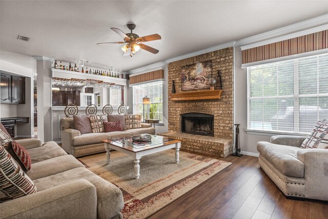 7705 Marble Canyon Ct, Fort Worth, TX 76137 - living area with ceiling fan, wood-type flooring, a fireplace, baseboards, and ornamental molding