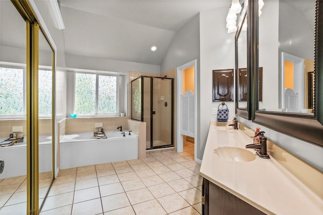 7705 Marble Canyon Ct, Fort Worth, TX 76137 - bathroom with a garden tub, a shower stall, tile patterned flooring, double vanity, and lofted ceiling